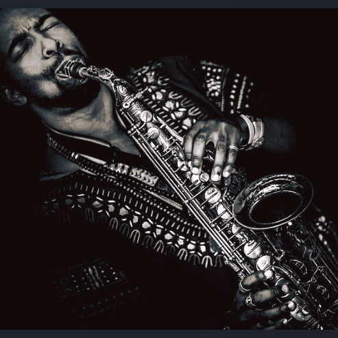 Marcus playing saxophone (B&W image)