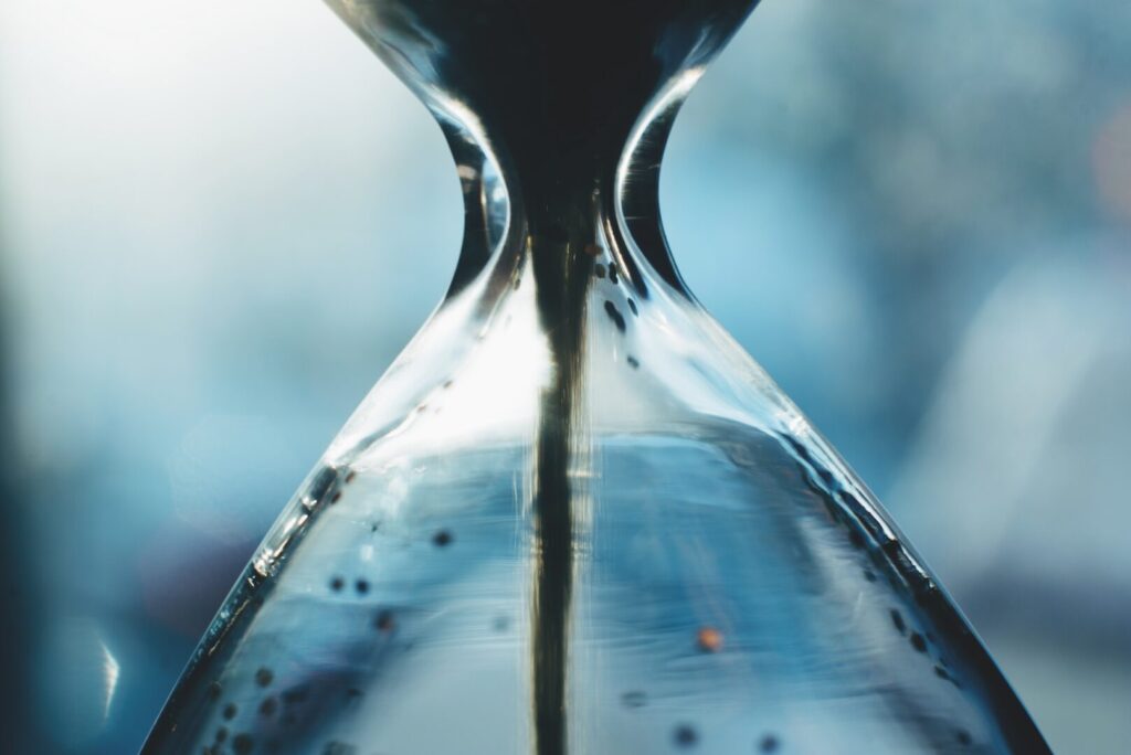 Sand,Running,Through,The,Bulbs,Of,An,Hourglass.,Deadline,Concept.